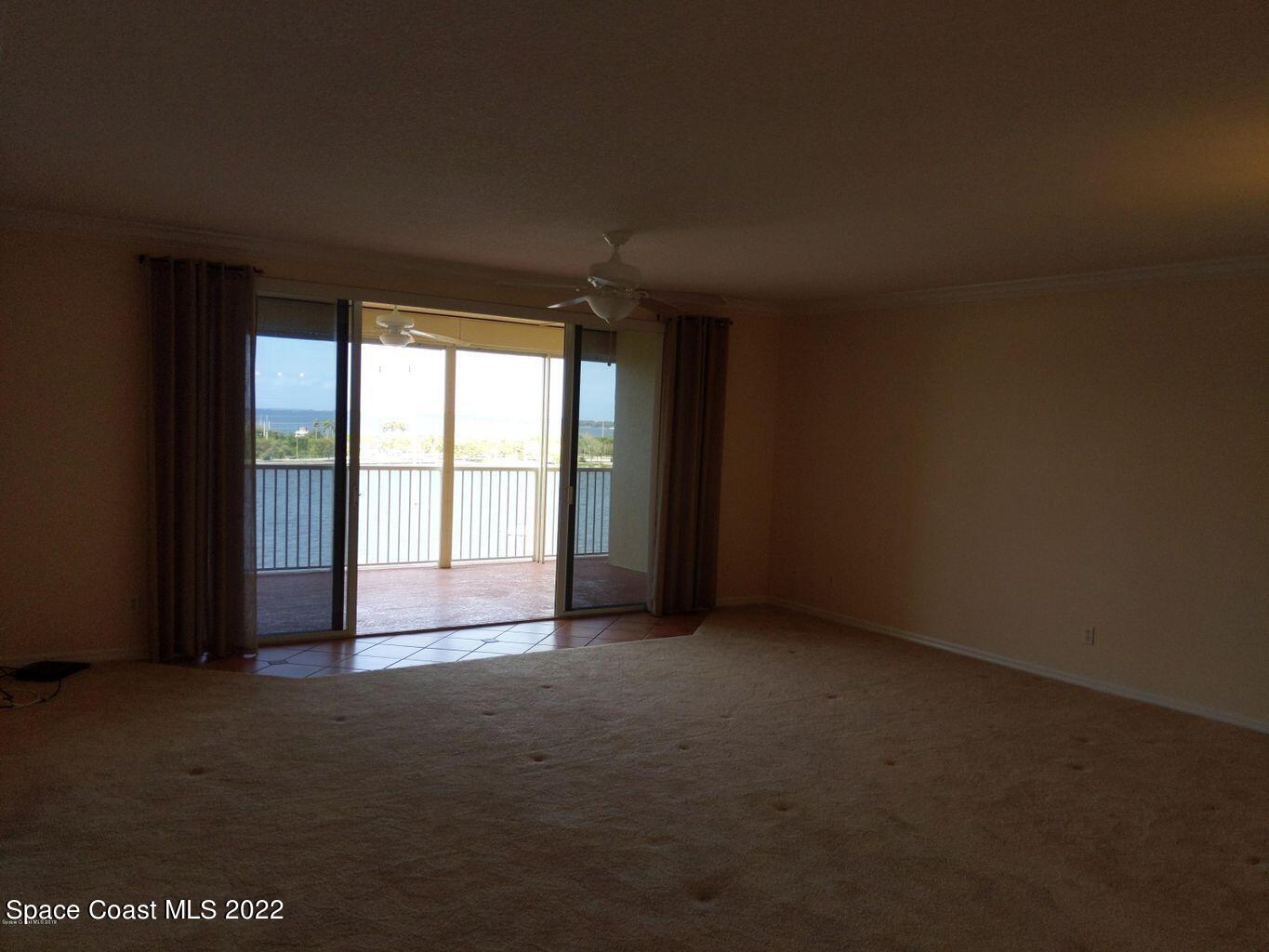 100 Riverside Drive, Unit 702 Cocoa, FL 32922 - Photo 11 of 33 a view of empty room with floor to ceiling window