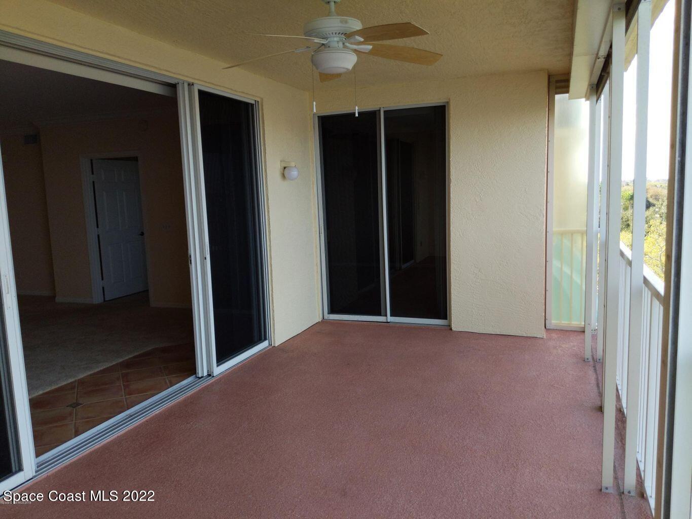 100 Riverside Drive, Unit 702 Cocoa, FL 32922 - Photo 19 of 33 a view of a hallway with wooden floor and a window