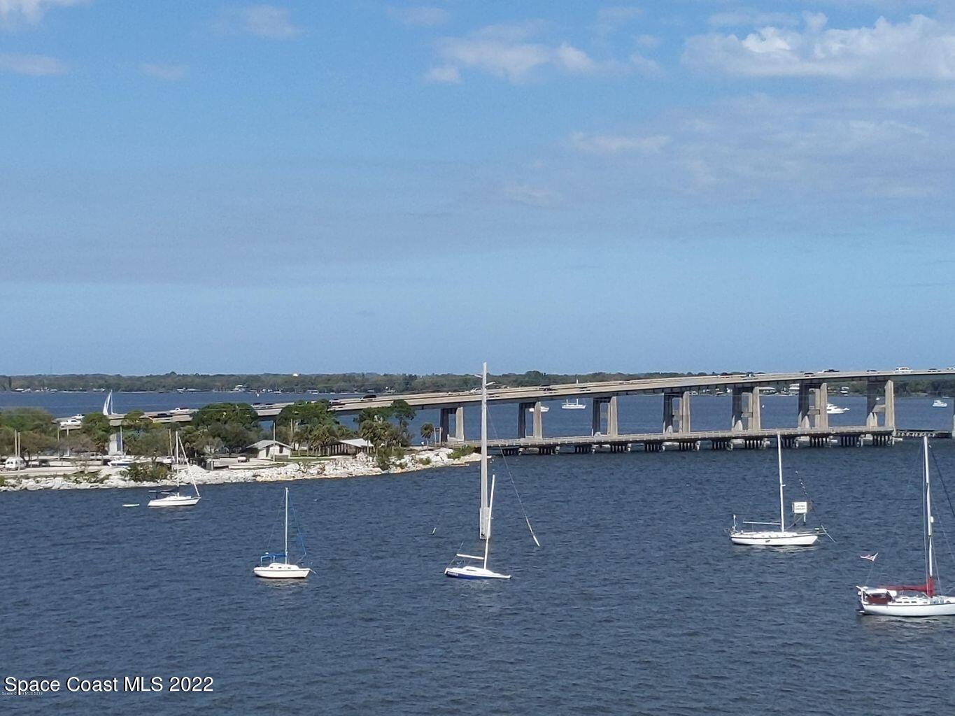 100 Riverside Drive, Unit 702 Cocoa, FL 32922 - Photo 22 of 33 a view of a lake with house