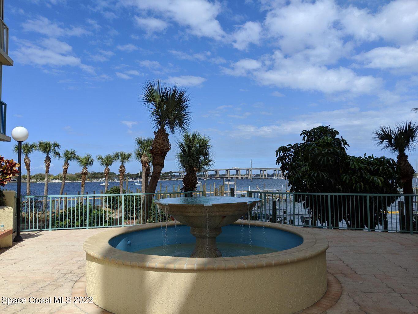100 Riverside Drive, Unit 702 Cocoa, FL 32922 - Photo 26 of 33 a view of a swimming pool with a patio