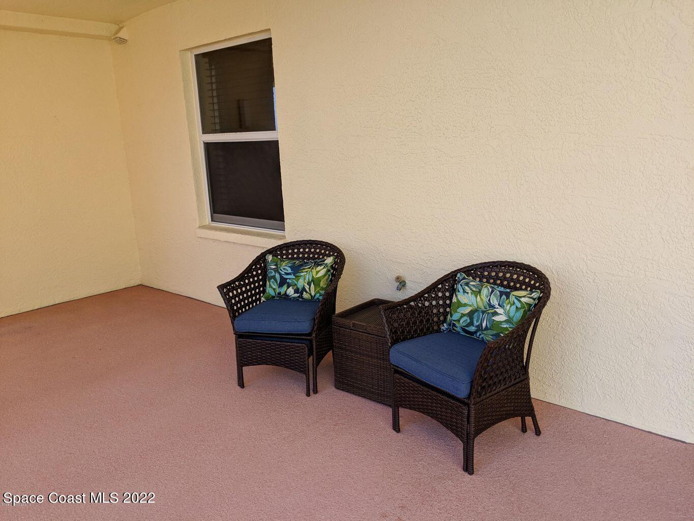 100 Riverside Drive, Unit 702 Cocoa, FL 32922 - Photo 3 of 33 a living room with furniture and a window