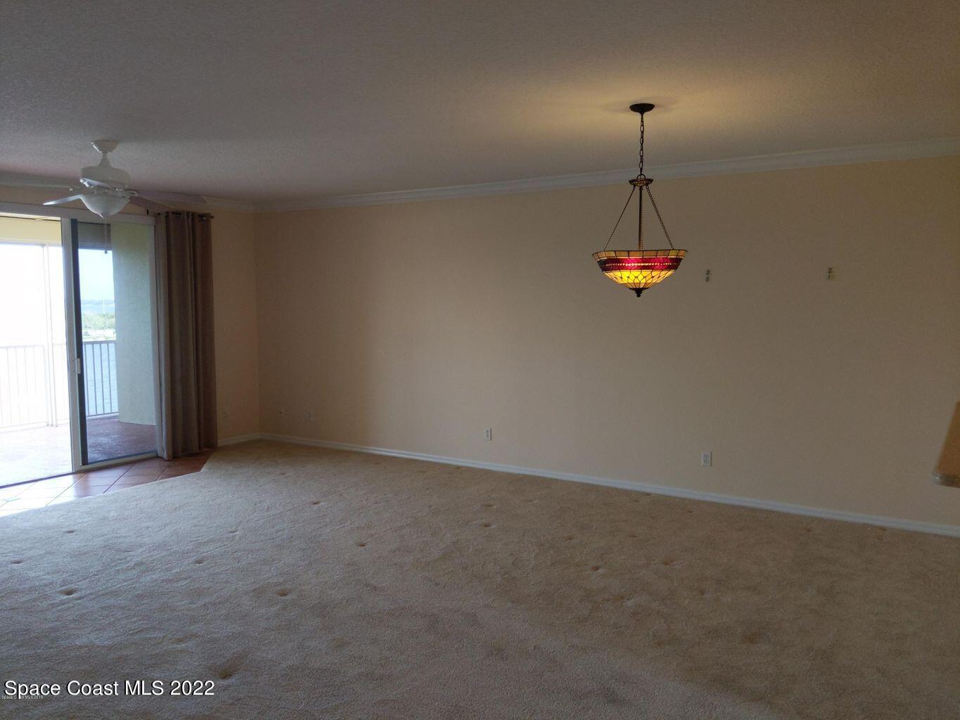 100 Riverside Drive, Unit 702 Cocoa, FL 32922 - Photo 10 of 33 an empty room with a empty space and windows