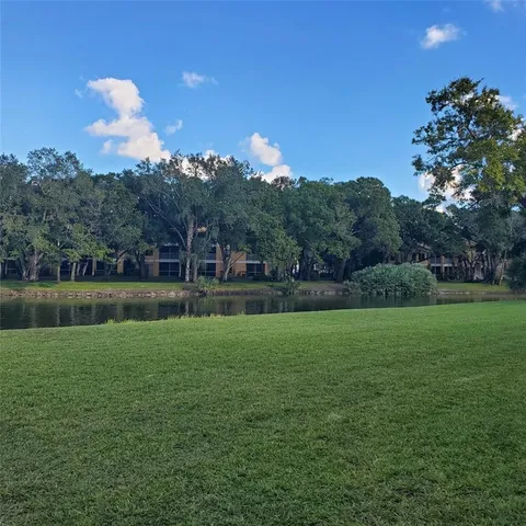 a view of a golf course with a lake