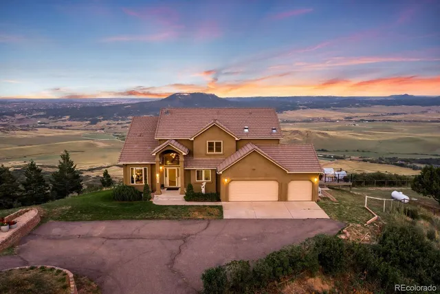 a view of a town with mountains in the background
