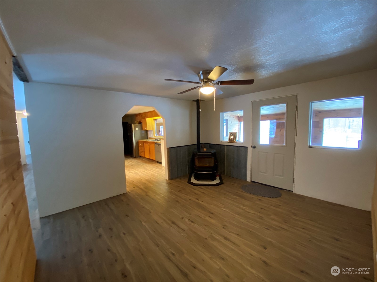 114 Twisp River Road Twisp, WA 98856 - Photo 12 of 35 a view of a livingroom with a piano and wooden floor