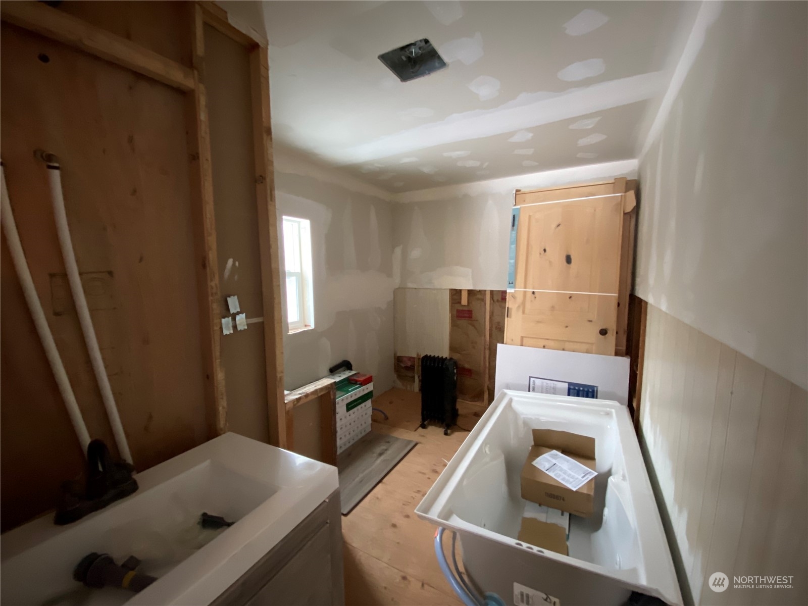 114 Twisp River Road Twisp, WA 98856 - Photo 18 of 35 a kitchen with a refrigerator and a stove