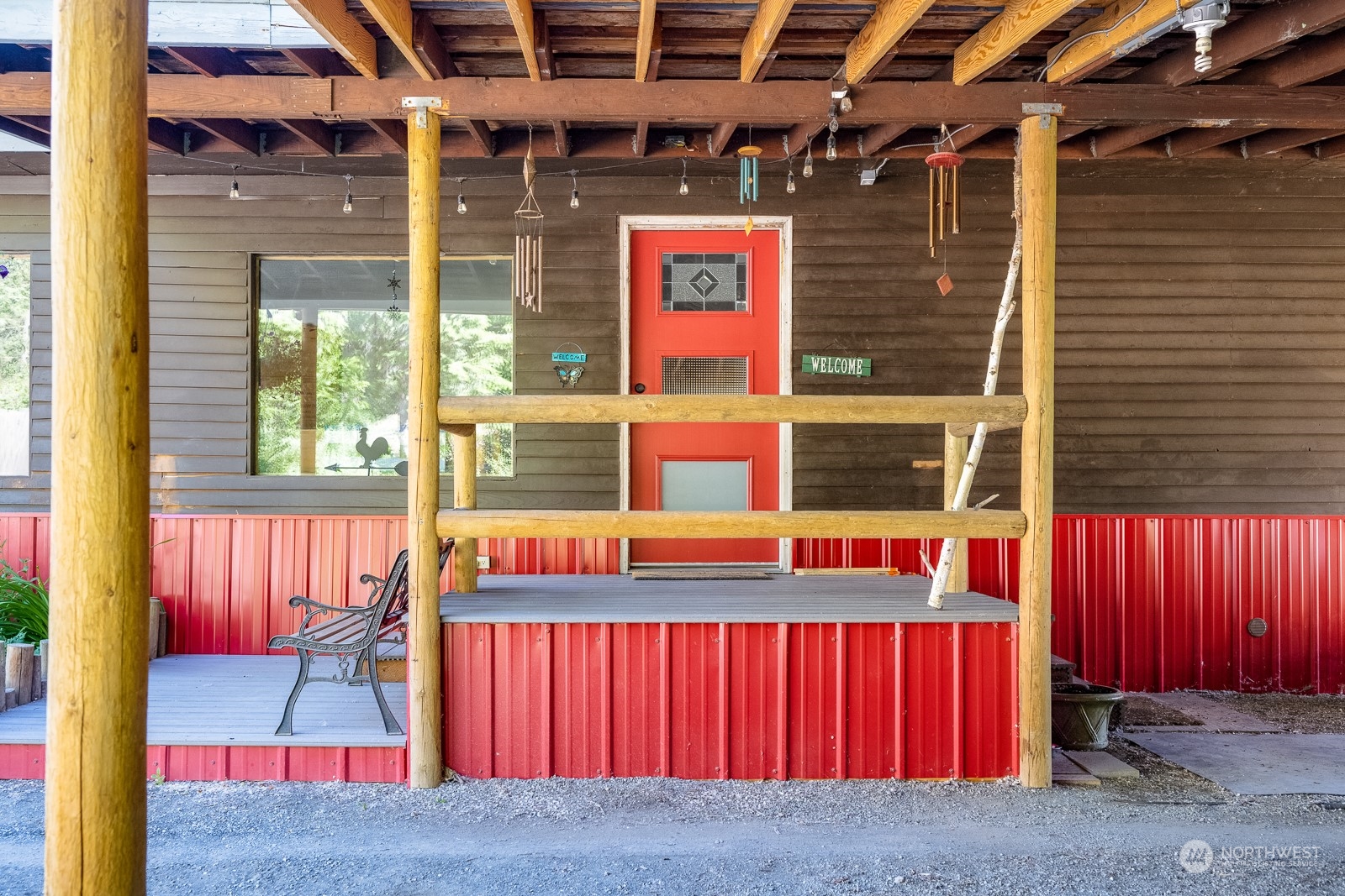 114 Twisp River Road Twisp, WA 98856 - Photo 2 of 35 a view of a brick building with a bench in front of it