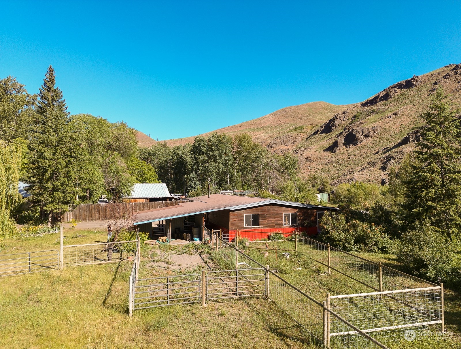 114 Twisp River Road Twisp, WA 98856 - Photo 34 of 35 a view of a big yard with potted plants