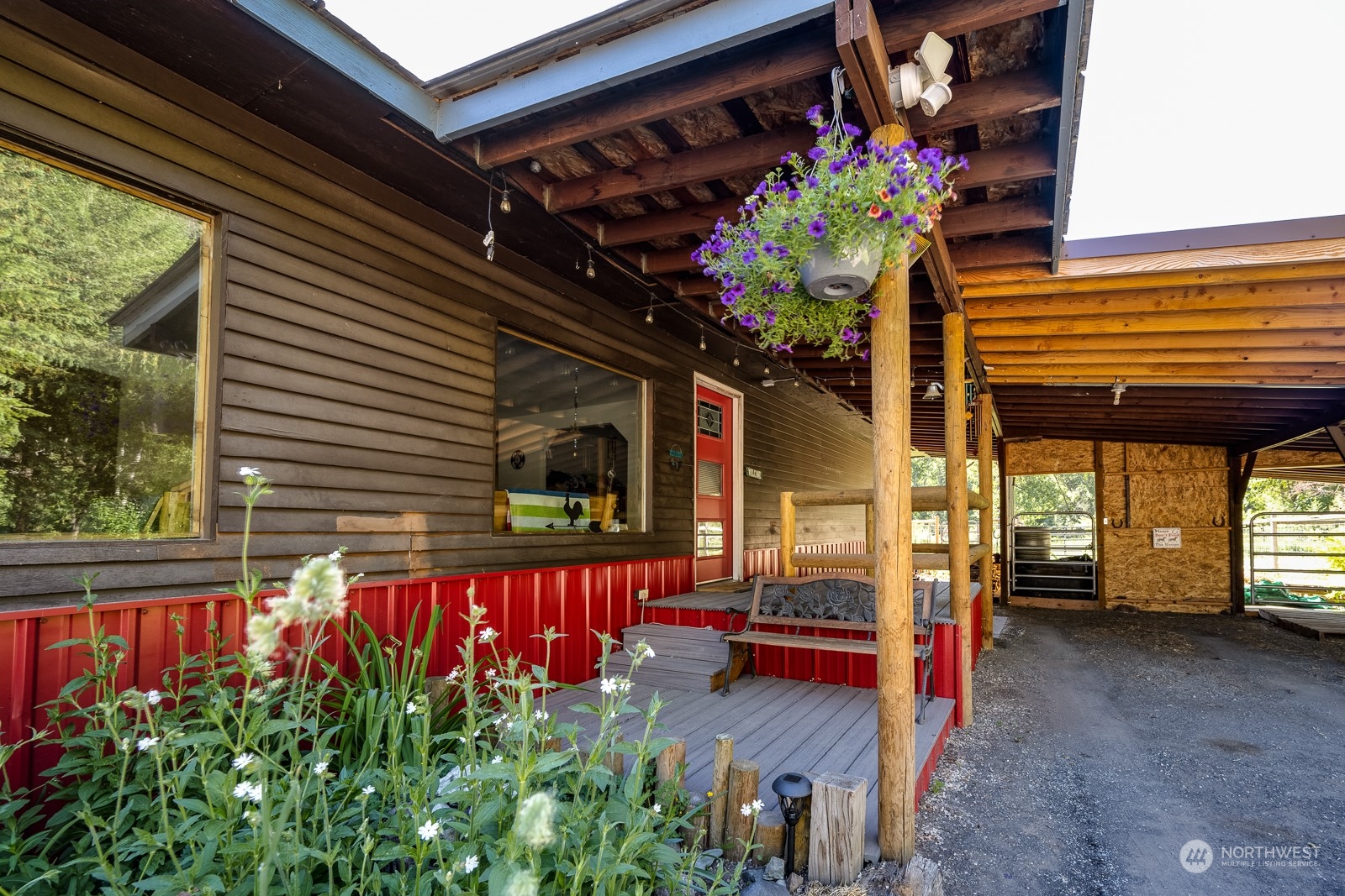 114 Twisp River Road Twisp, WA 98856 - Photo 4 of 35 a view of a porch with a bench