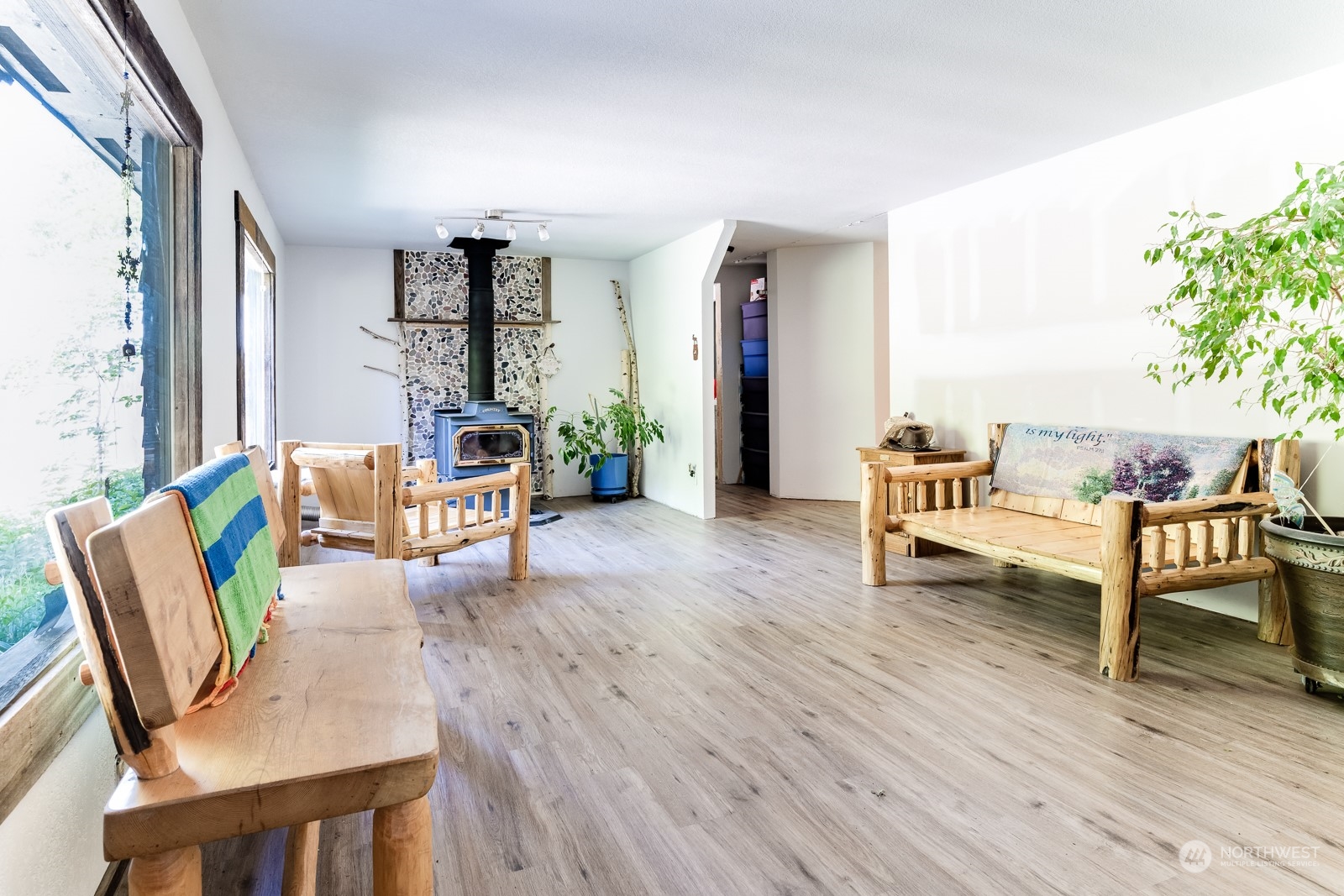 114 Twisp River Road Twisp, WA 98856 - Photo 5 of 35 a living room with furniture and a wooden floor