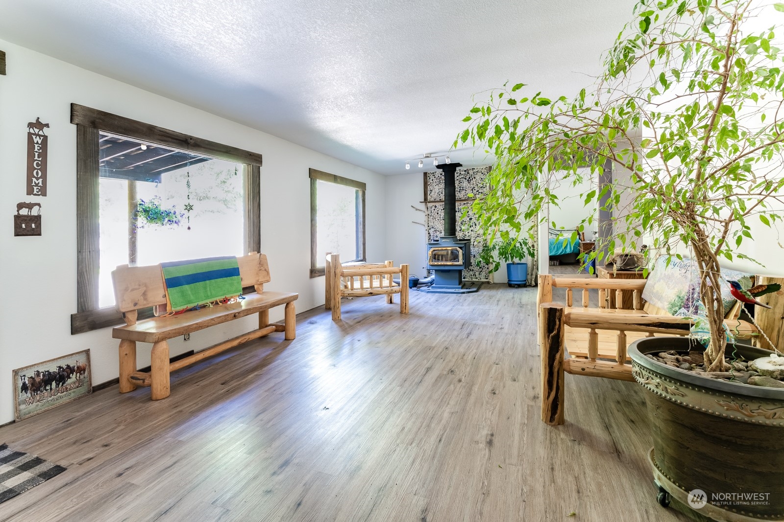 114 Twisp River Road Twisp, WA 98856 - Photo 6 of 35 a living room with furniture and a wooden floor