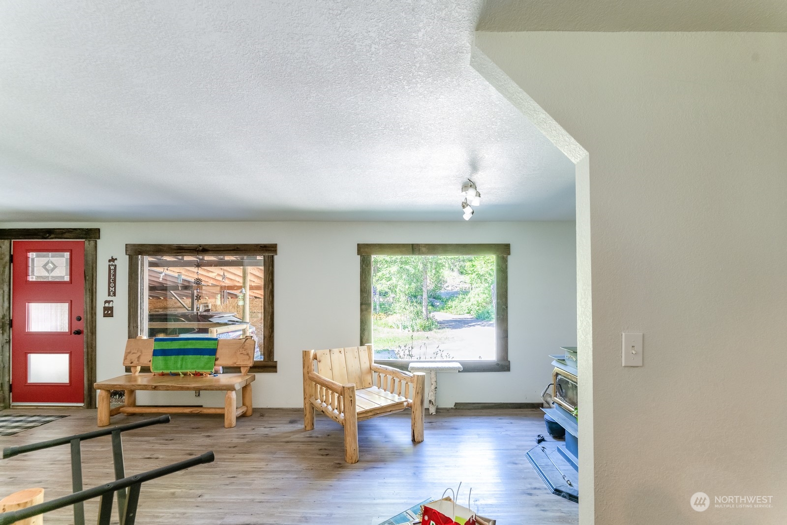 114 Twisp River Road Twisp, WA 98856 - Photo 8 of 35 a living room with furniture and a window