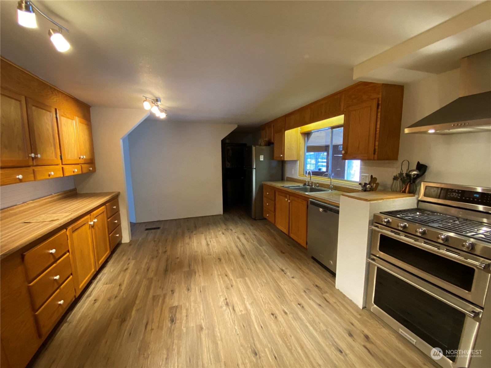 114 Twisp River Road Twisp, WA 98856 - Photo 9 of 35 a kitchen with stainless steel appliances granite countertop a stove and a sink