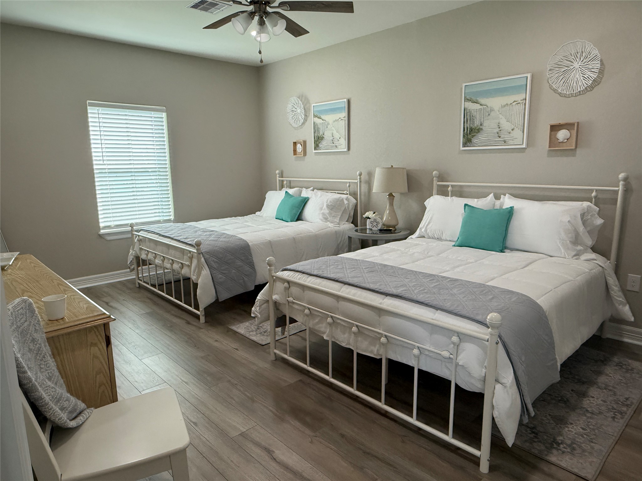 528 Thunder Road Surfside Beach, TX 77541 - Photo 13 of 22 a bedroom with two beds and a chandelier