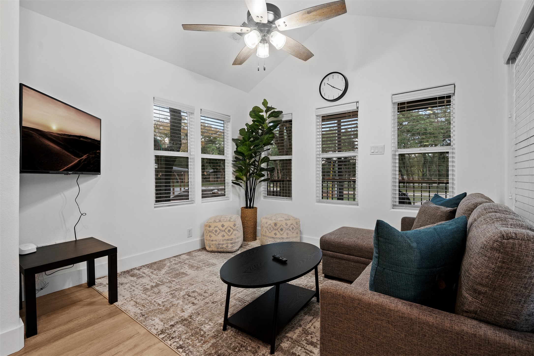 1100 Live Oak Road Leander, TX 78641 - Photo 35 of 40 a living room with furniture a flat screen tv and a window