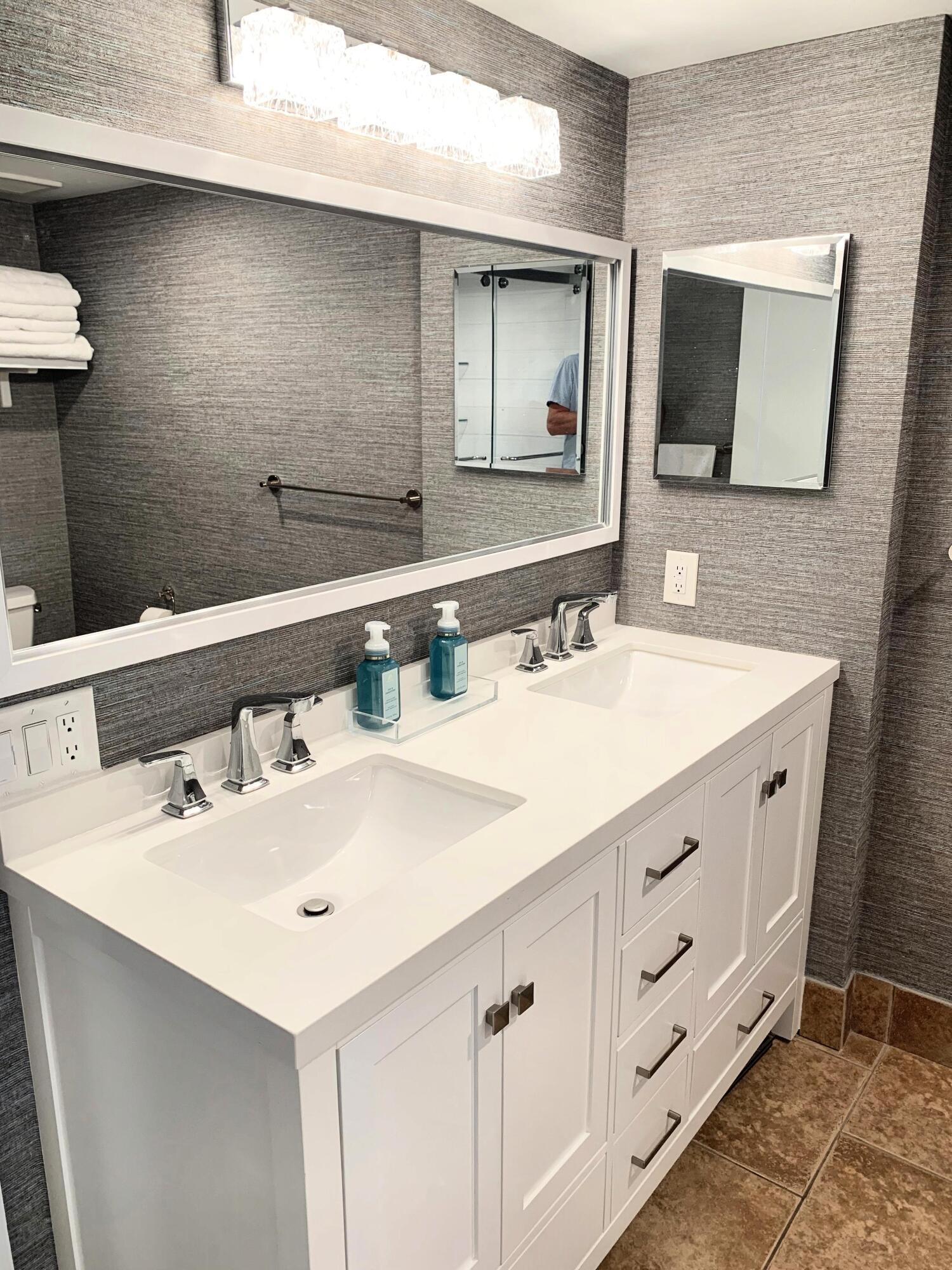 3604 South Ocean Boulevard, Unit 101 Highland Beach, FL 33487 - Photo 11 of 36 a bathroom with a sink and a mirror
