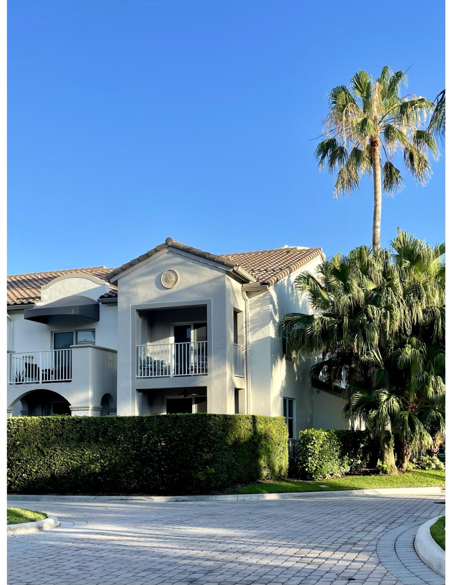 3604 South Ocean Boulevard, Unit 101 Highland Beach, FL 33487 - Photo 19 of 36 a front view of a house with a yard