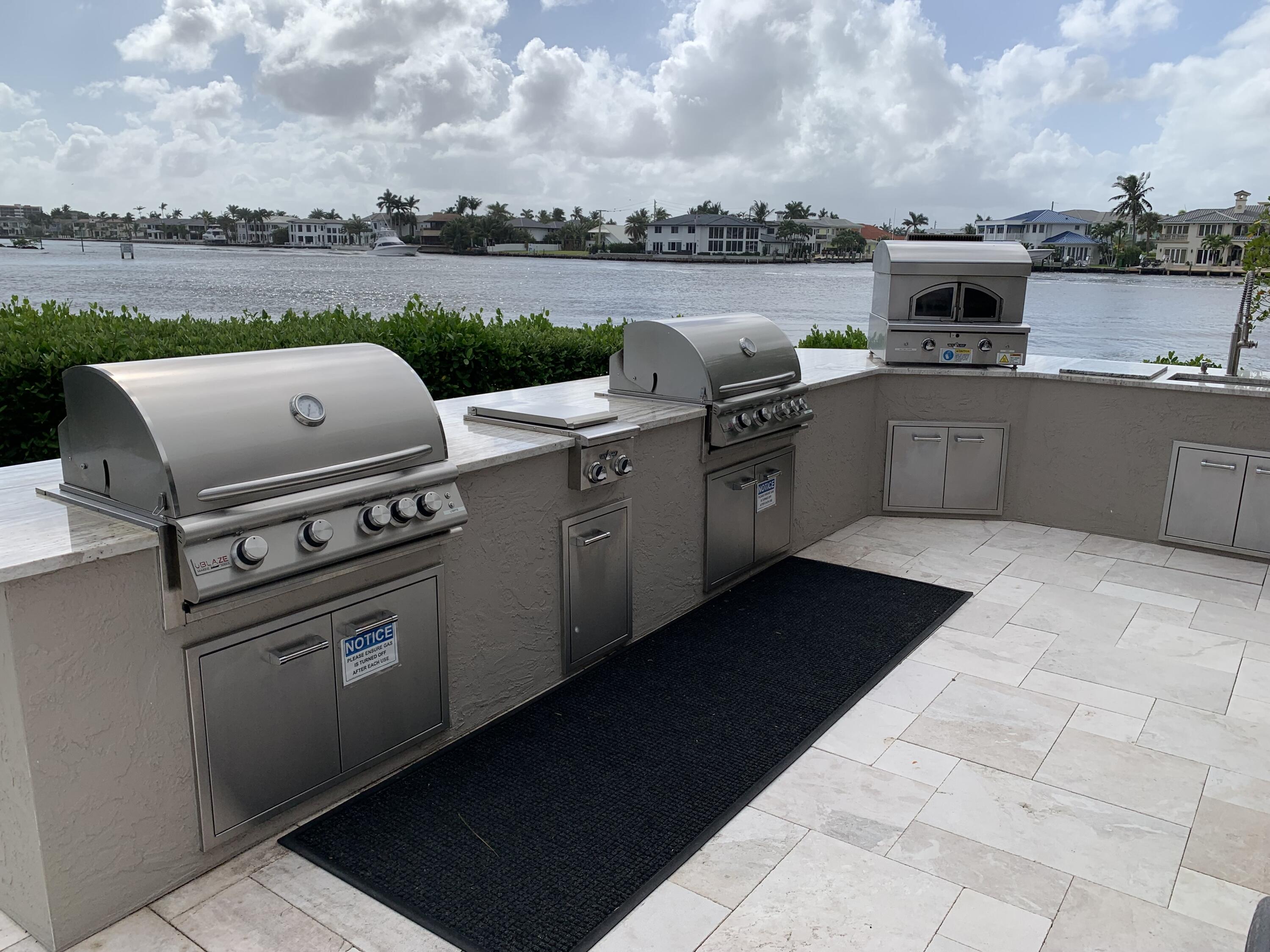 3604 South Ocean Boulevard, Unit 101 Highland Beach, FL 33487 - Photo 22 of 36 a view of a terrace with a kitchen