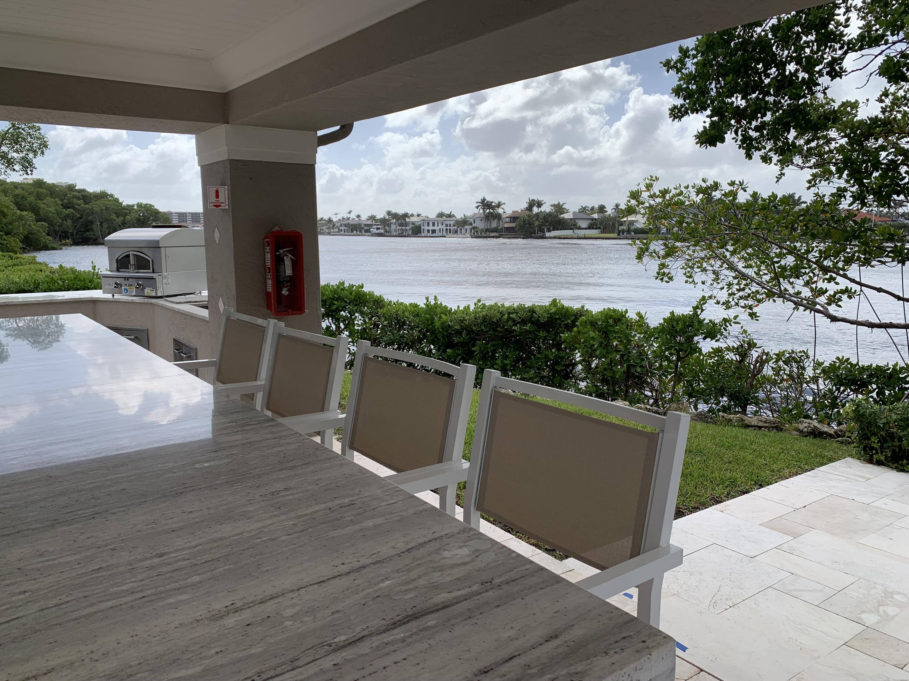 3604 South Ocean Boulevard, Unit 101 Highland Beach, FL 33487 - Photo 23 of 36 a view of a terrace with yard and lake view