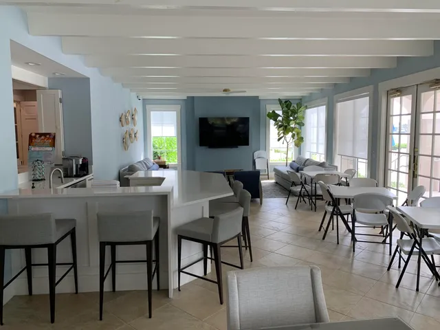 a view of a dining room with furniture and window