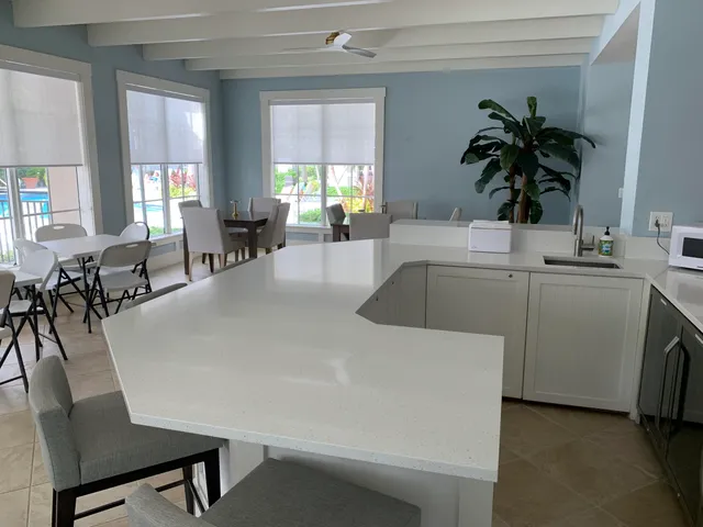 a view of a kitchen living room and dining room