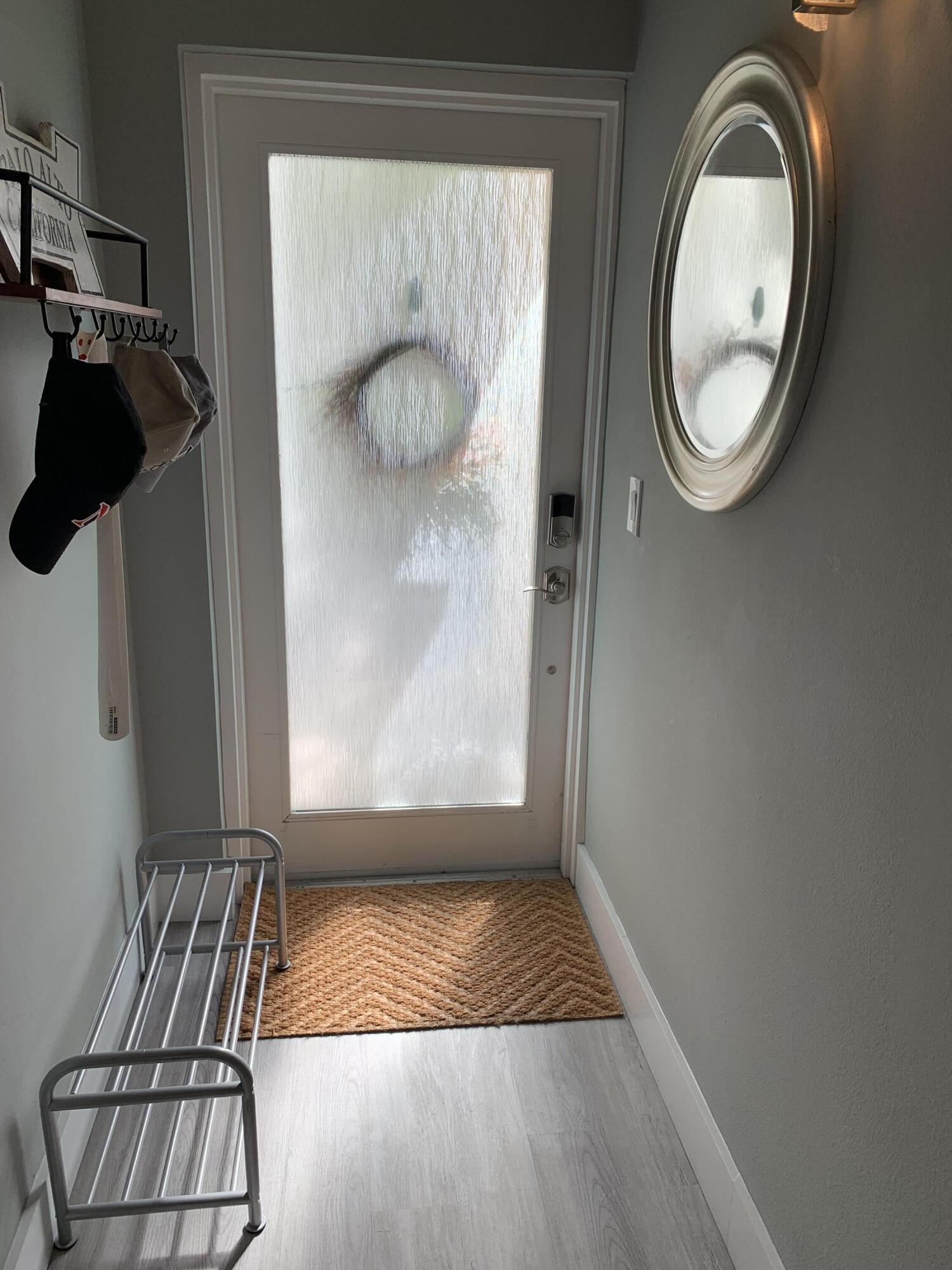 3604 South Ocean Boulevard, Unit 101 Highland Beach, FL 33487 - Photo 6 of 36 a view of entryway with wooden floor