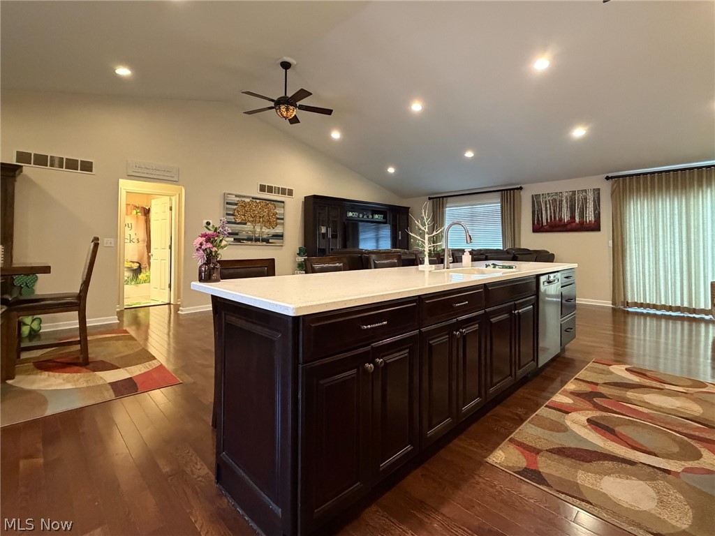 1343 Courtland Road Weirton, WV 26062 - Photo 10 of 50 Kitchen featuring dark wood finished floors, a ceiling fan, an island with sink, recessed lighting, and vaulted ceiling