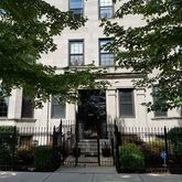front view of a house with a tree