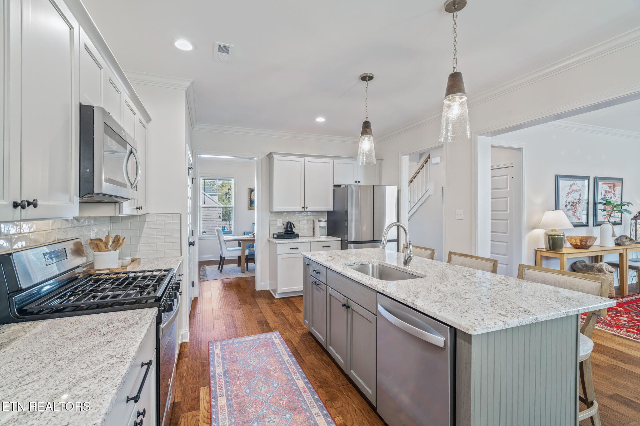 1146 Madison Oaks Road Knoxville, TN 37924 - Photo 13 of 48 a kitchen with a stove sink and cabinets