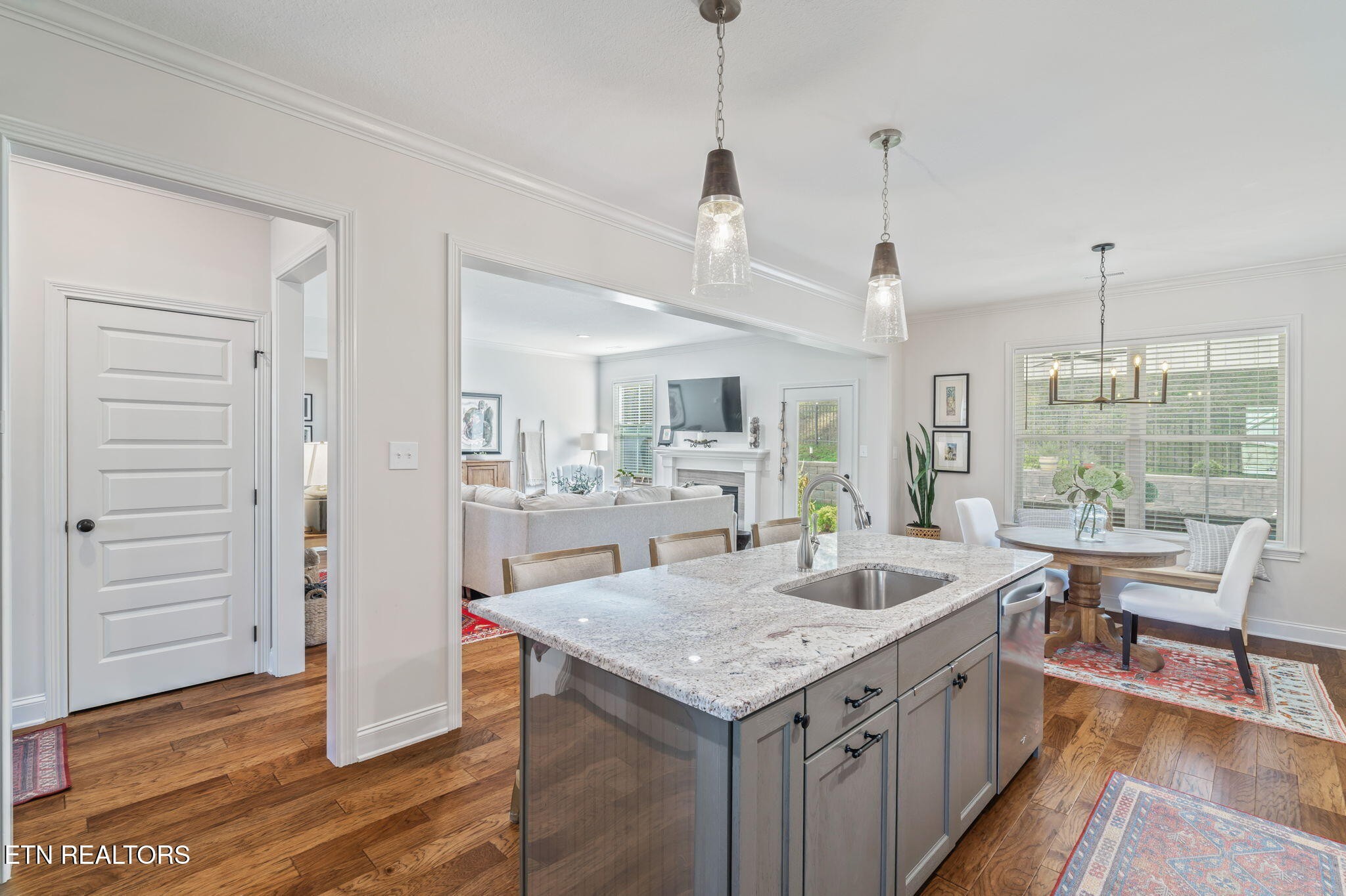 1146 Madison Oaks Road Knoxville, TN 37924 - Photo 14 of 48 a large kitchen with sink a refrigerator and wooden floor