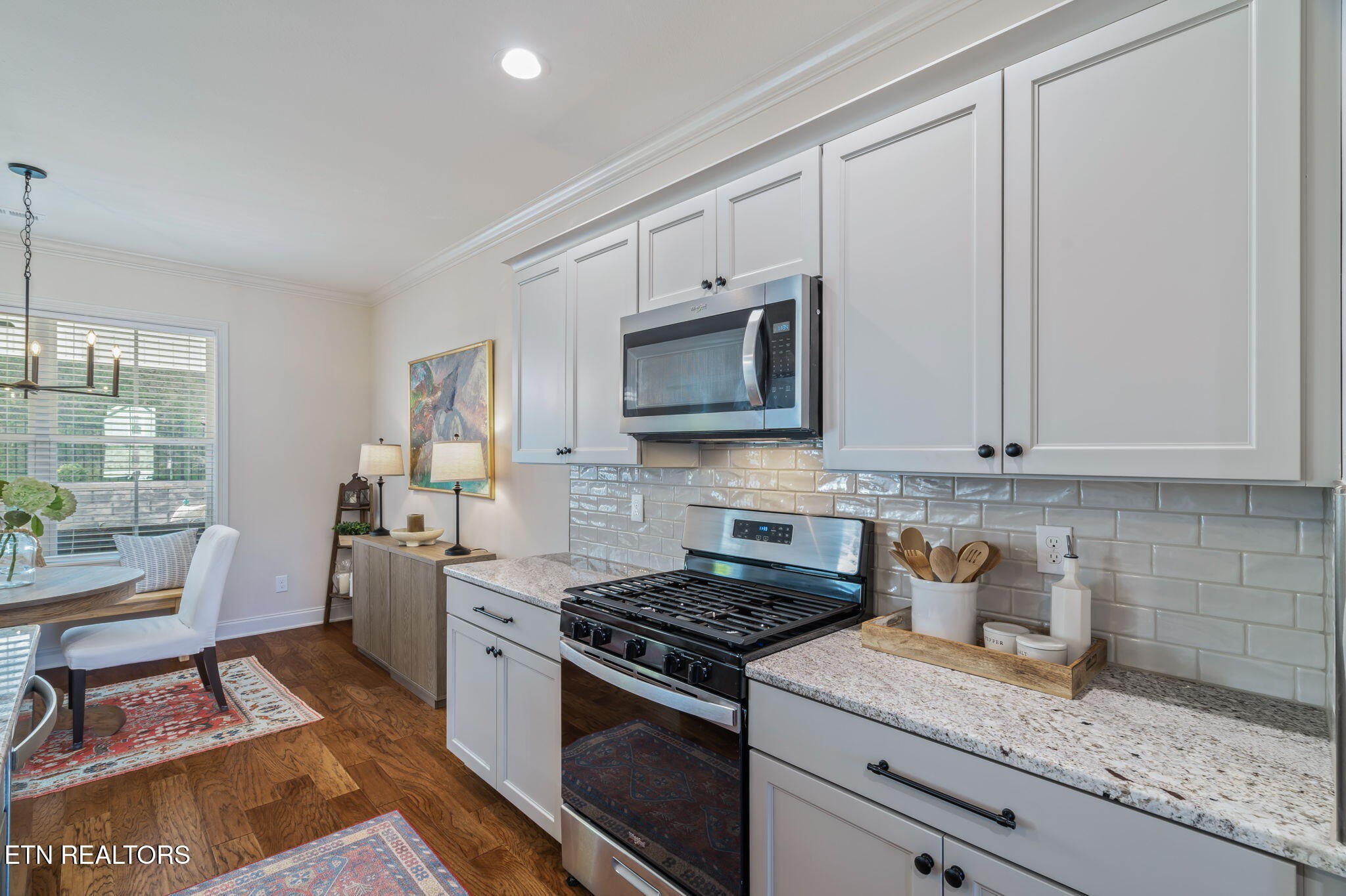 1146 Madison Oaks Road Knoxville, TN 37924 - Photo 16 of 48 a kitchen with stainless steel appliances granite countertop a stove a sink and a microwave