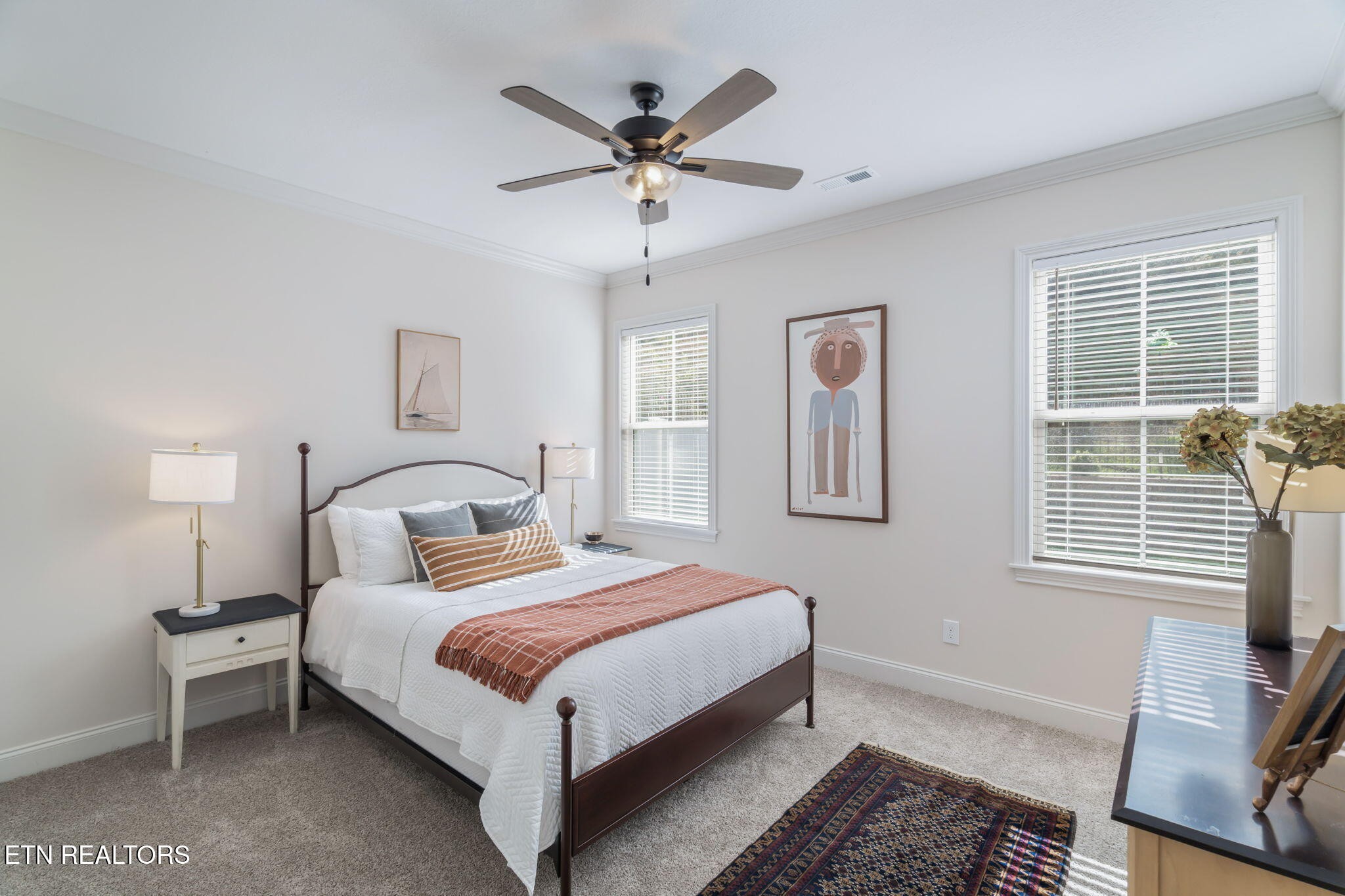 1146 Madison Oaks Road Knoxville, TN 37924 - Photo 19 of 48 a bedroom with a bed a window and a chandelier