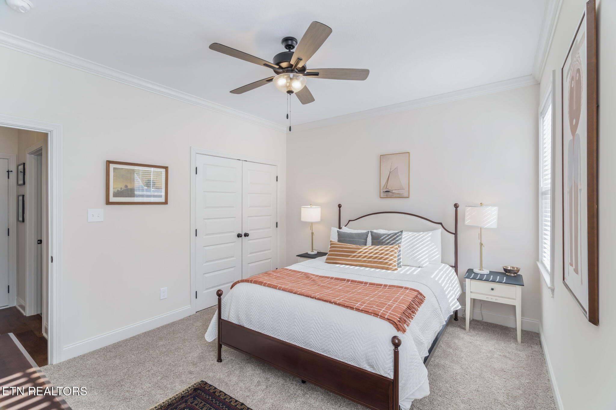 1146 Madison Oaks Road Knoxville, TN 37924 - Photo 20 of 48 a bedroom with a bed and a chandelier
