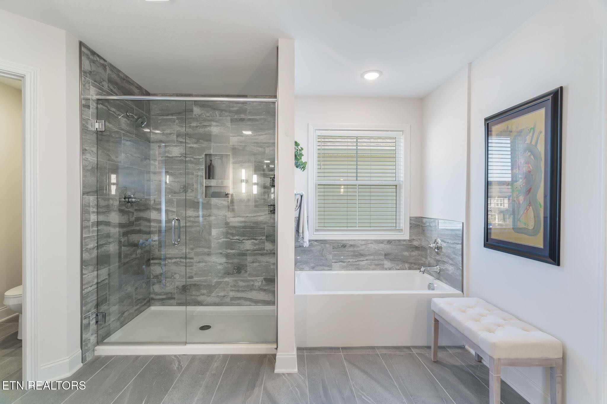 1146 Madison Oaks Road Knoxville, TN 37924 - Photo 27 of 48 a bathroom with a bathtub and a shower