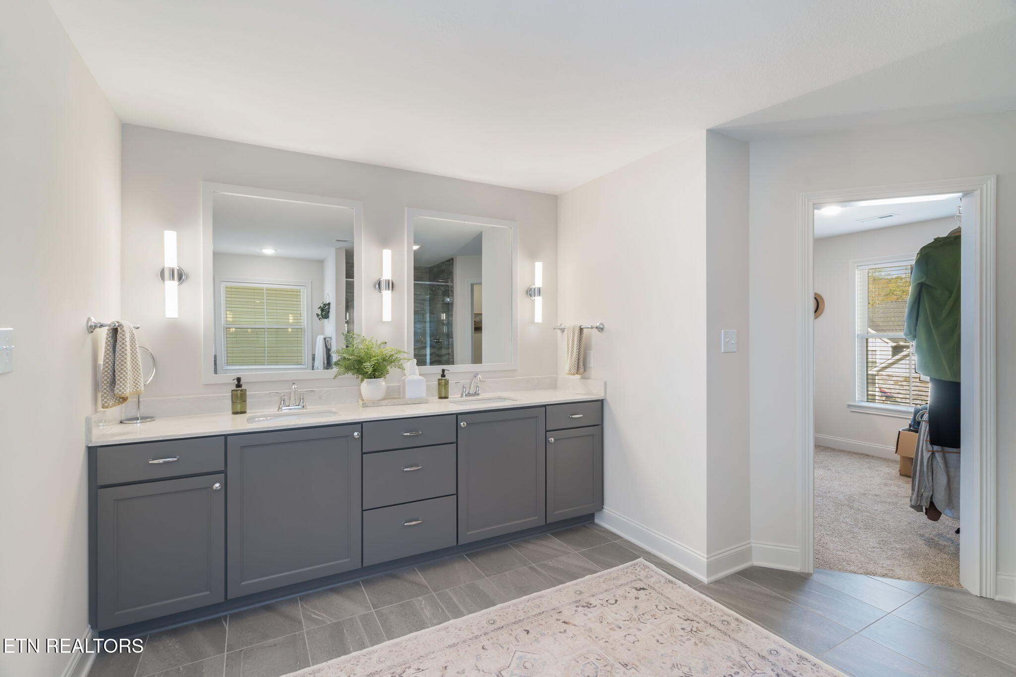 1146 Madison Oaks Road Knoxville, TN 37924 - Photo 29 of 48 a spacious bathroom with a double vanity sink and a mirror