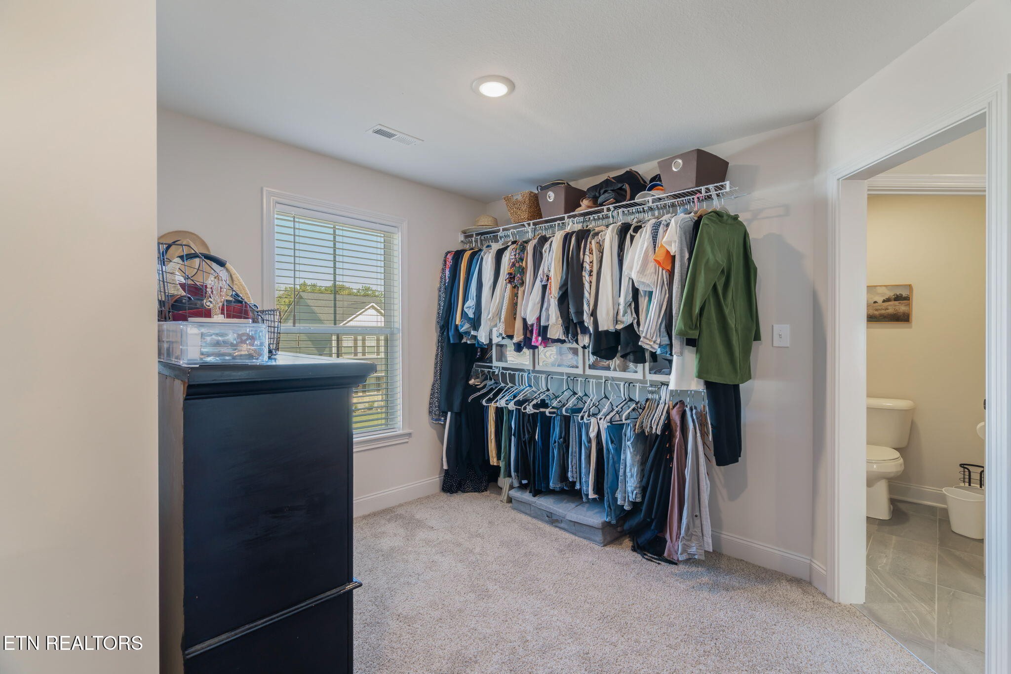 1146 Madison Oaks Road Knoxville, TN 37924 - Photo 30 of 48 a view of walk in closet with clothes and shoes