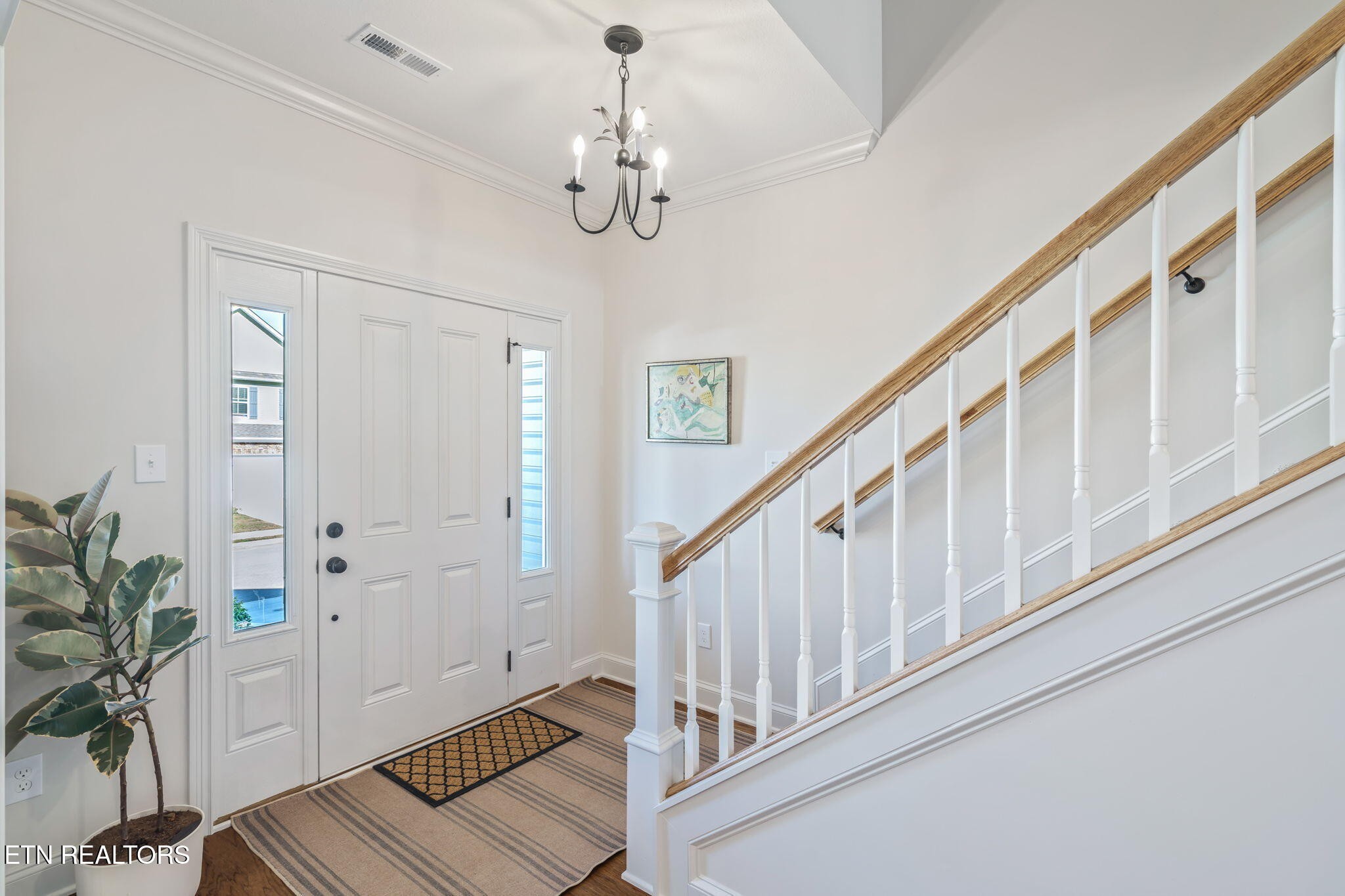 1146 Madison Oaks Road Knoxville, TN 37924 - Photo 3 of 48 a view of a hallway with wooden floor and staircase