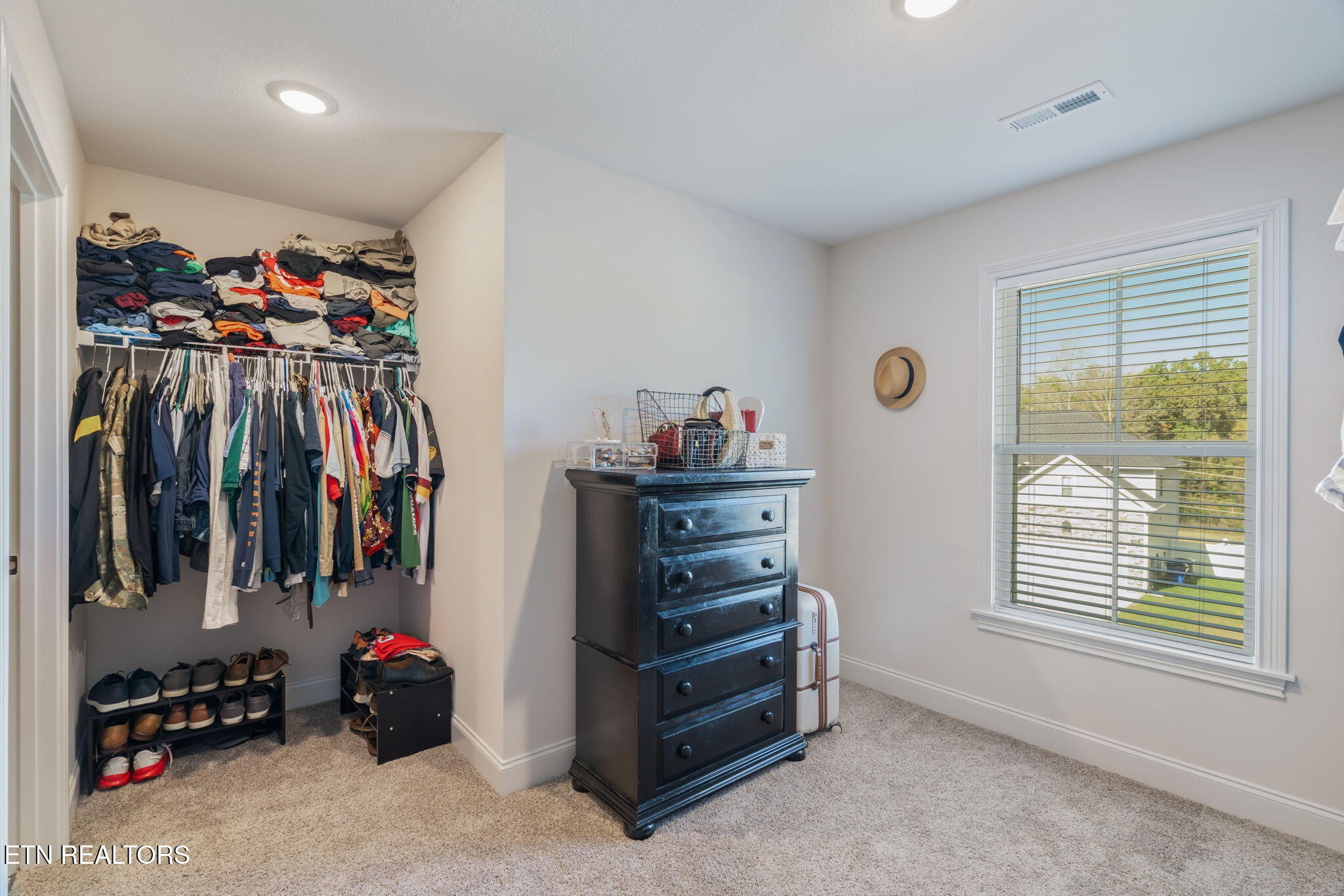 1146 Madison Oaks Road Knoxville, TN 37924 - Photo 31 of 48 a view of walk in closet with clothes and shoes