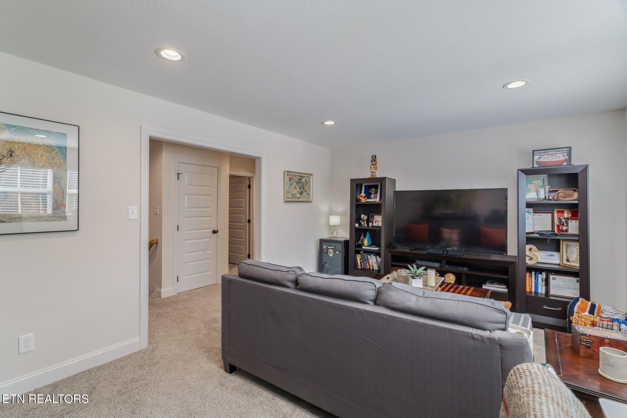 1146 Madison Oaks Road Knoxville, TN 37924 - Photo 34 of 48 a living room with furniture and a flat screen tv