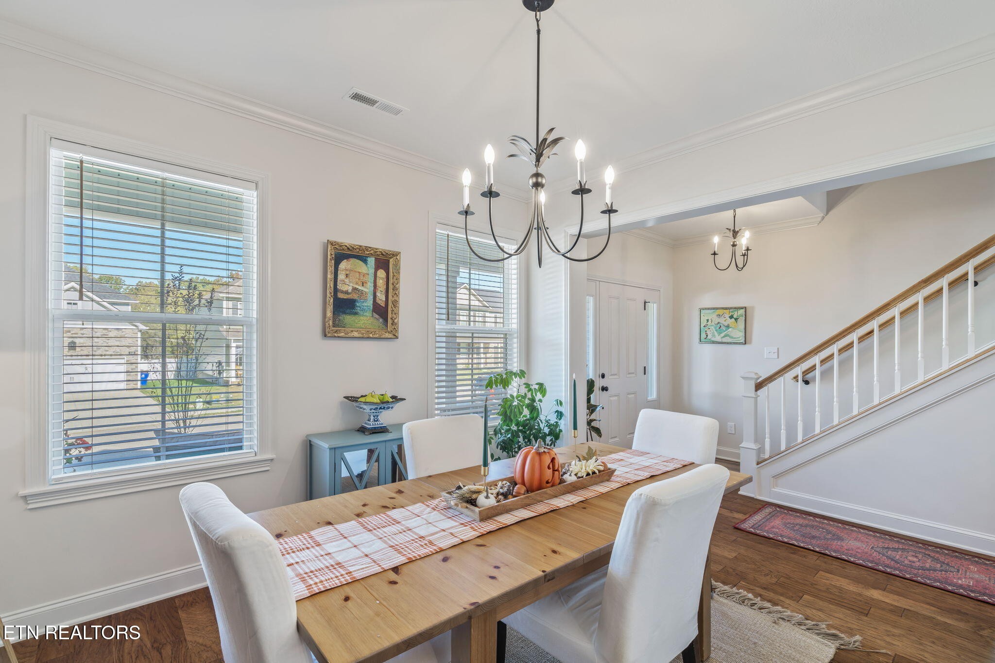 1146 Madison Oaks Road Knoxville, TN 37924 - Photo 4 of 48 a view of a dining room with furniture a chandelier and wooden floor