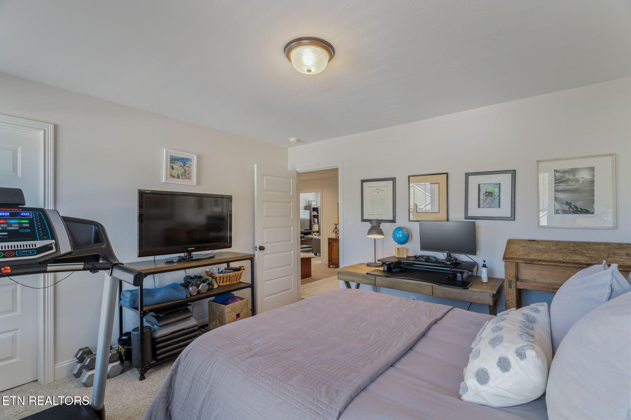 1146 Madison Oaks Road Knoxville, TN 37924 - Photo 42 of 48 a bedroom with furniture and a flat screen tv