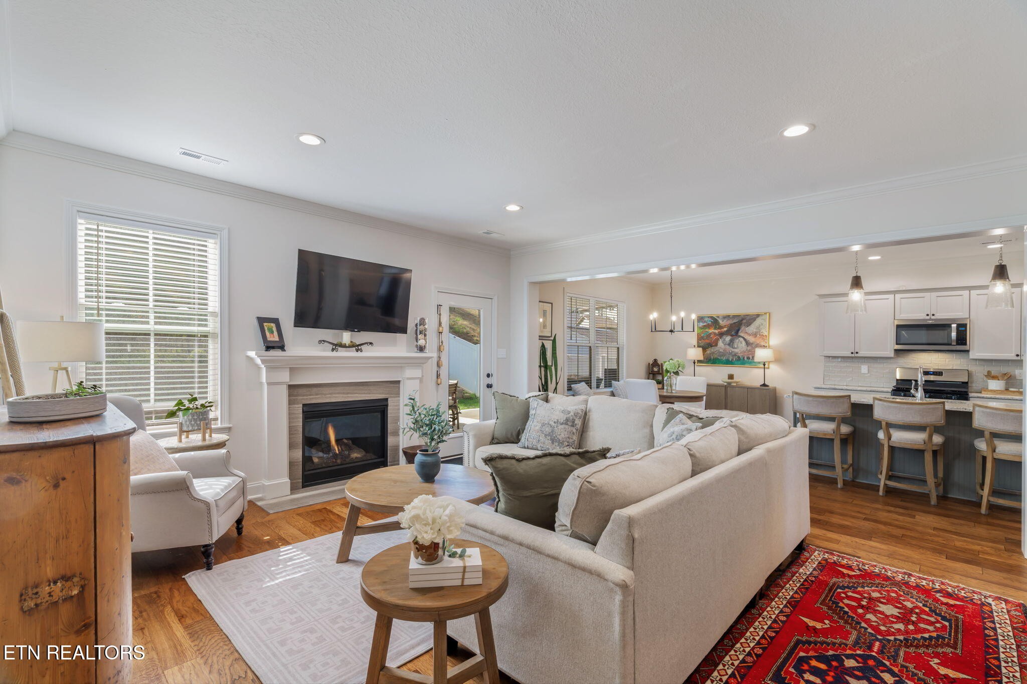 1146 Madison Oaks Road Knoxville, TN 37924 - Photo 6 of 48 a living room with furniture a fireplace and a flat screen tv