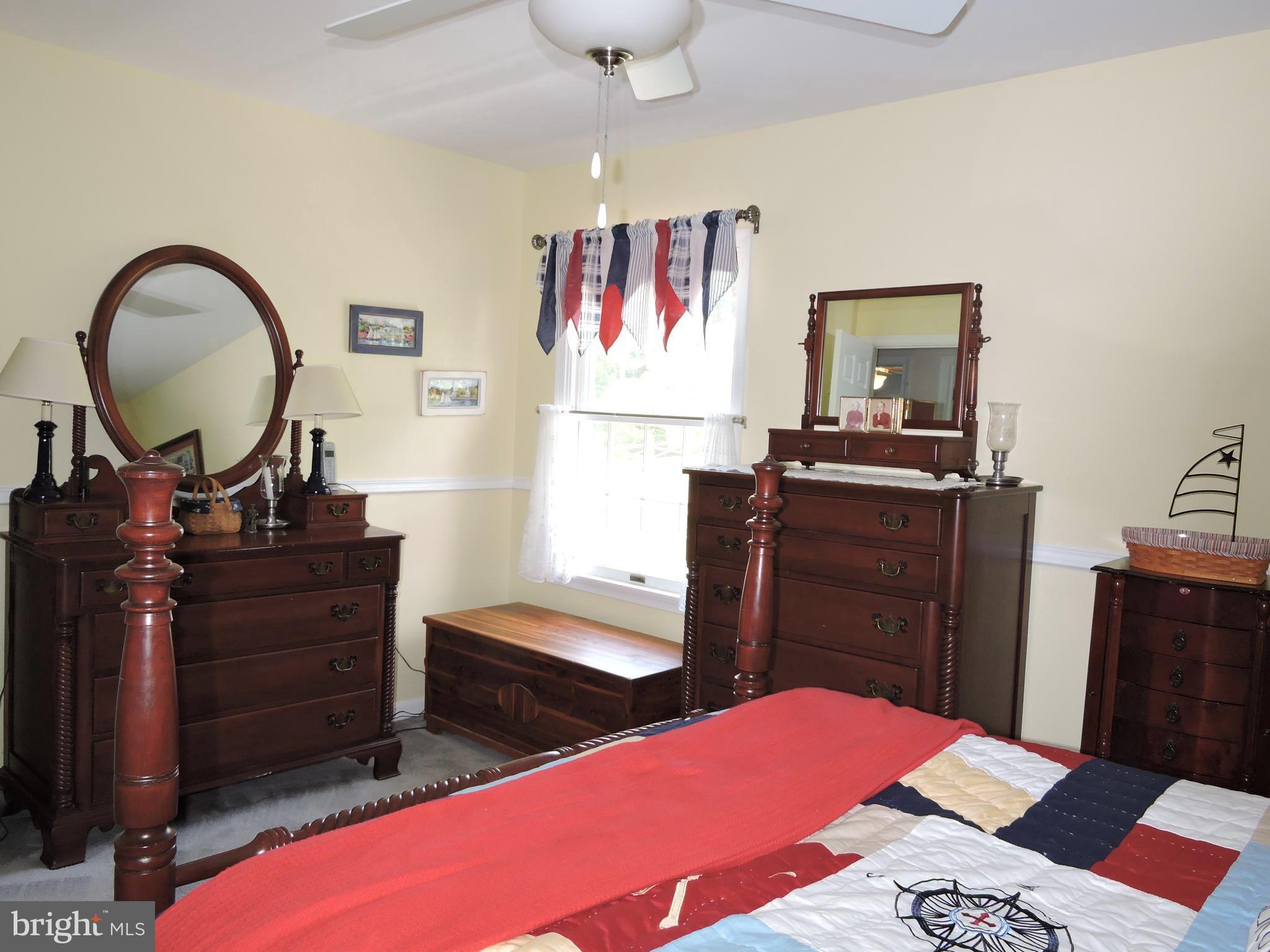 2758 Greene Lane Baldwin, MD 21013 - Photo 22 of 32 a bedroom with a bed and a dresser