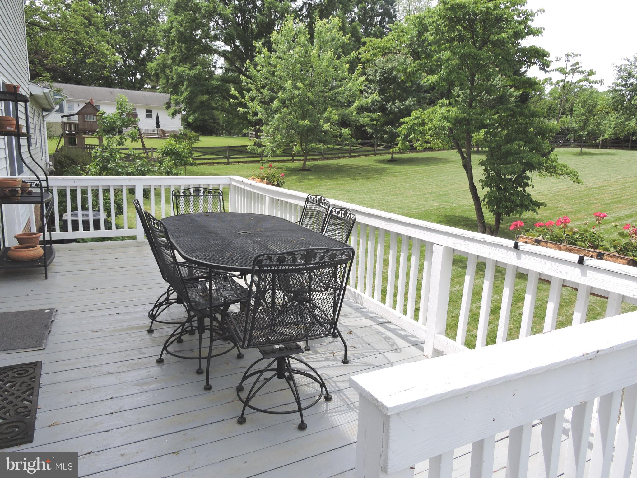 2758 Greene Lane Baldwin, MD 21013 - Photo 26 of 32 a view of a chairs and table on the deck