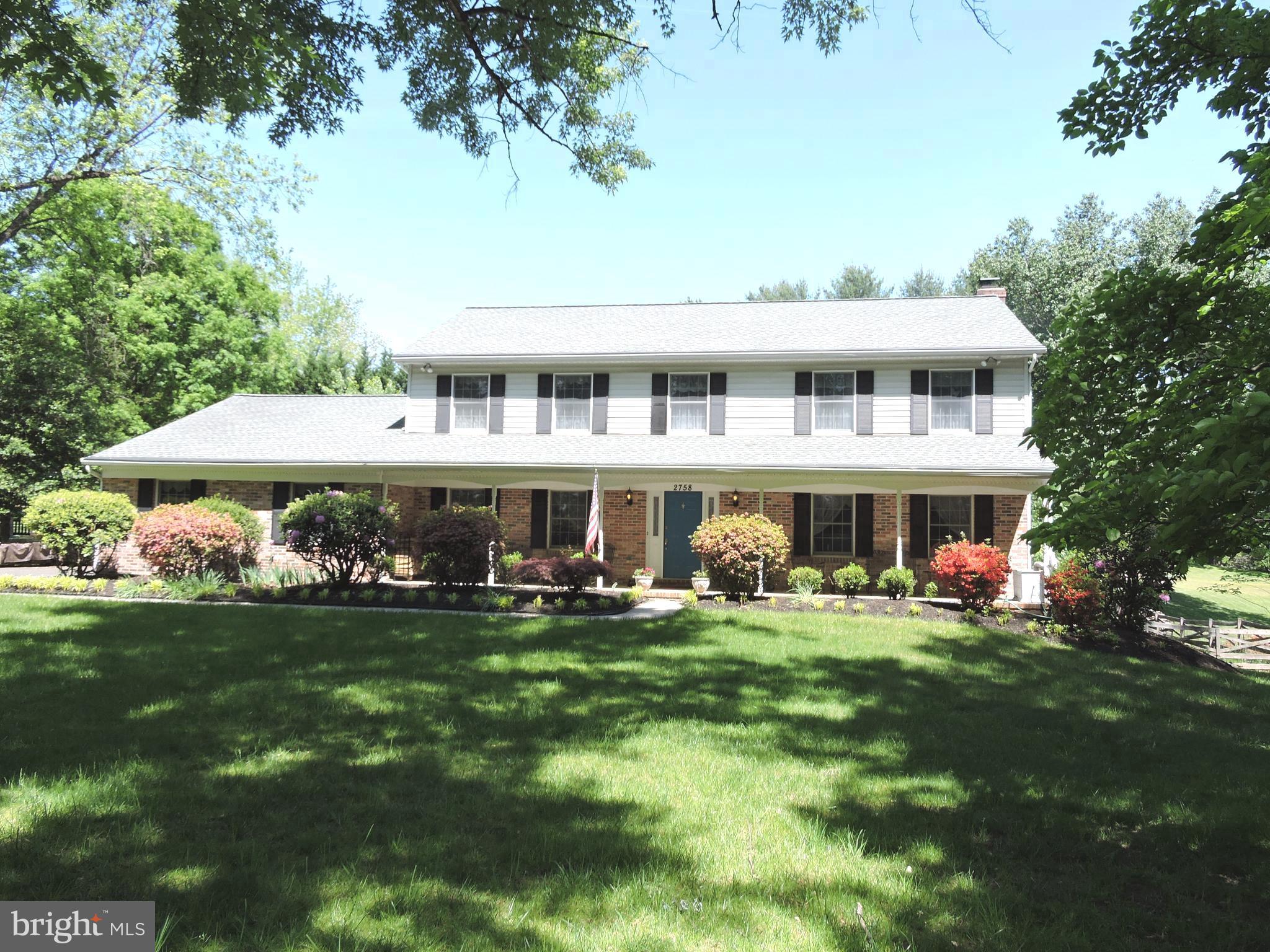 2758 Greene Lane Baldwin, MD 21013 - Photo 32 of 32 a front view of a house with a garden and trees