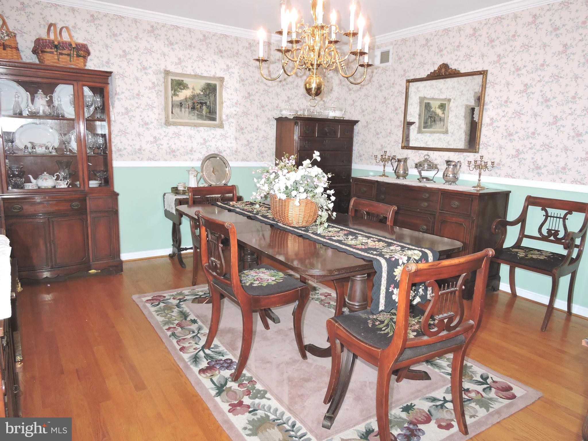 2758 Greene Lane Baldwin, MD 21013 - Photo 4 of 32 a view of a dining room with furniture and a chandelier