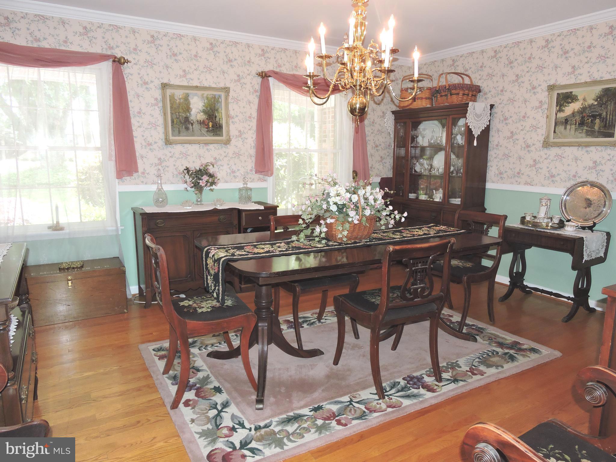 2758 Greene Lane Baldwin, MD 21013 - Photo 5 of 32 a dining room with chandelier and wooden floor