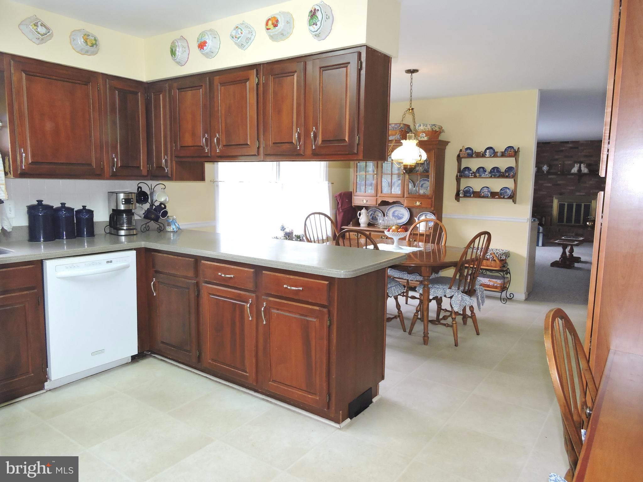 2758 Greene Lane Baldwin, MD 21013 - Photo 8 of 32 a kitchen with stainless steel appliances granite countertop a stove top oven a sink dishwasher and cabinets