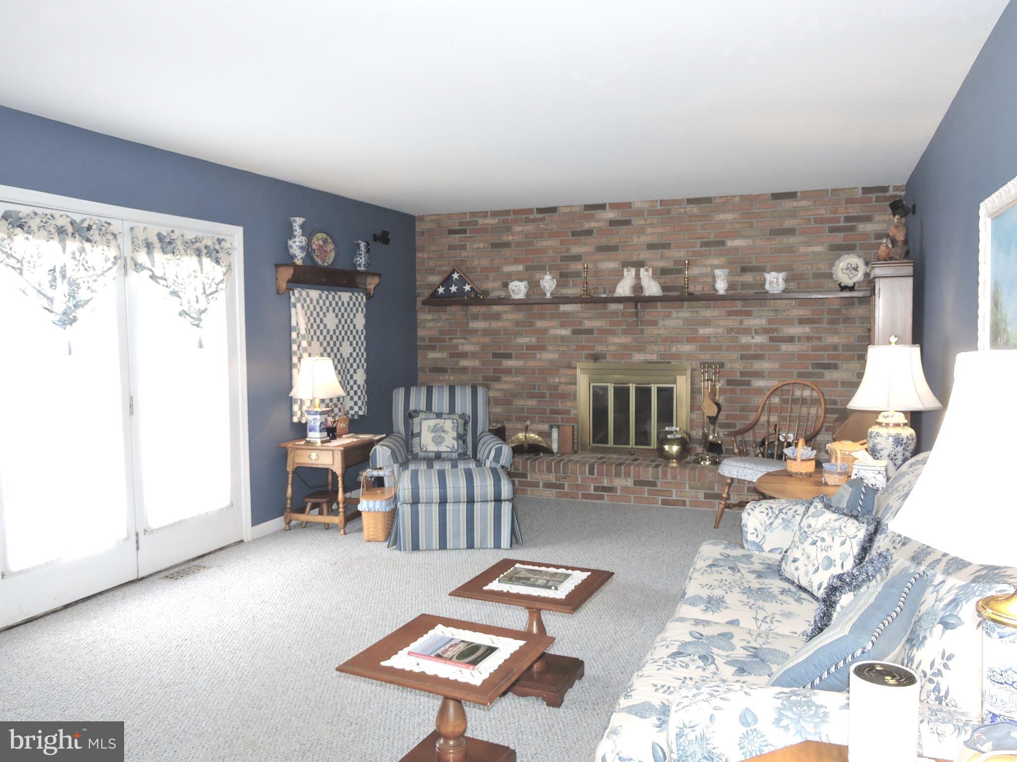 2758 Greene Lane Baldwin, MD 21013 - Photo 9 of 32 a living room with furniture and a fireplace