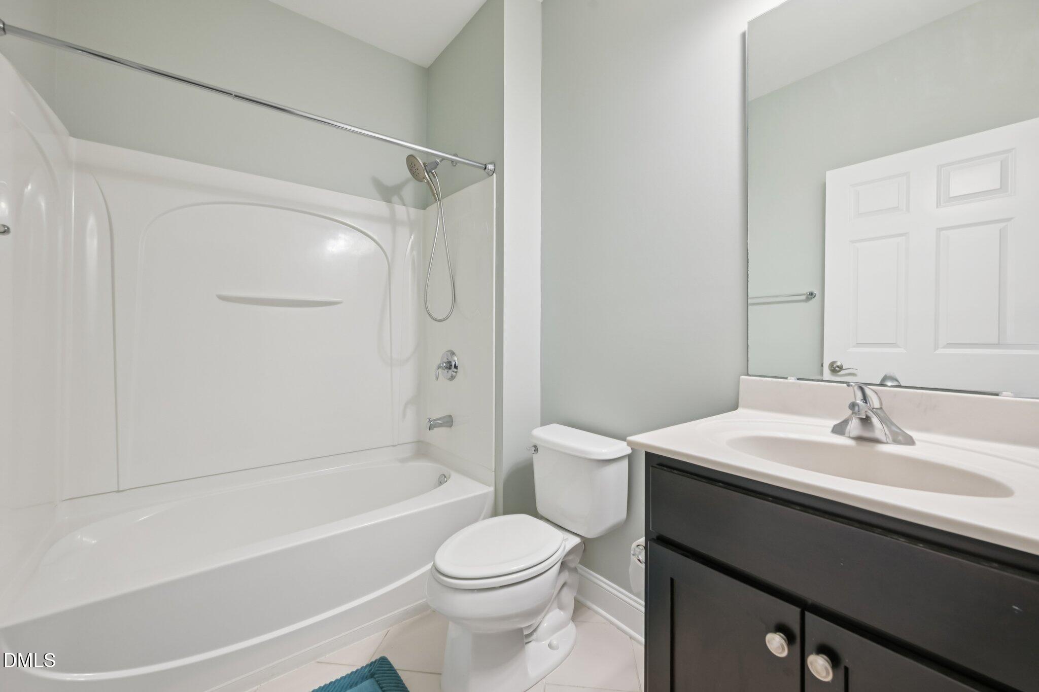 10510 Sablewood Drive, Unit 113 Raleigh, NC 27617 - Photo 36 of 38 a bathroom with a sink a toilet and a bathtub